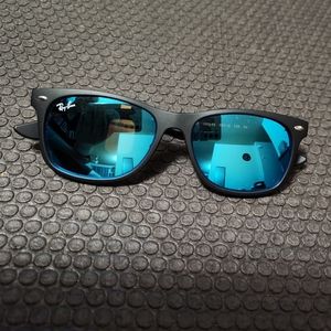 RayBan New Wayfarer black with blue mirror.